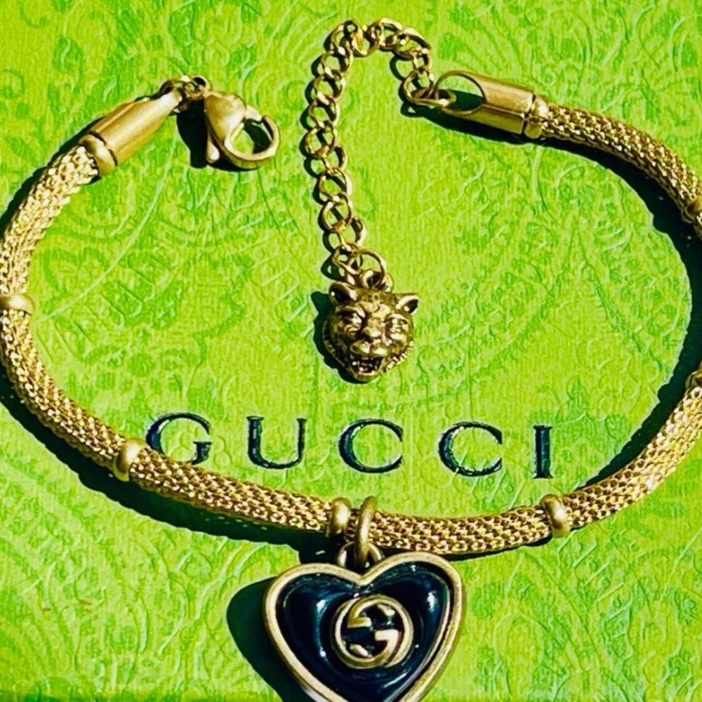 Gucci Gold Bracelet with Black Heart Pendant